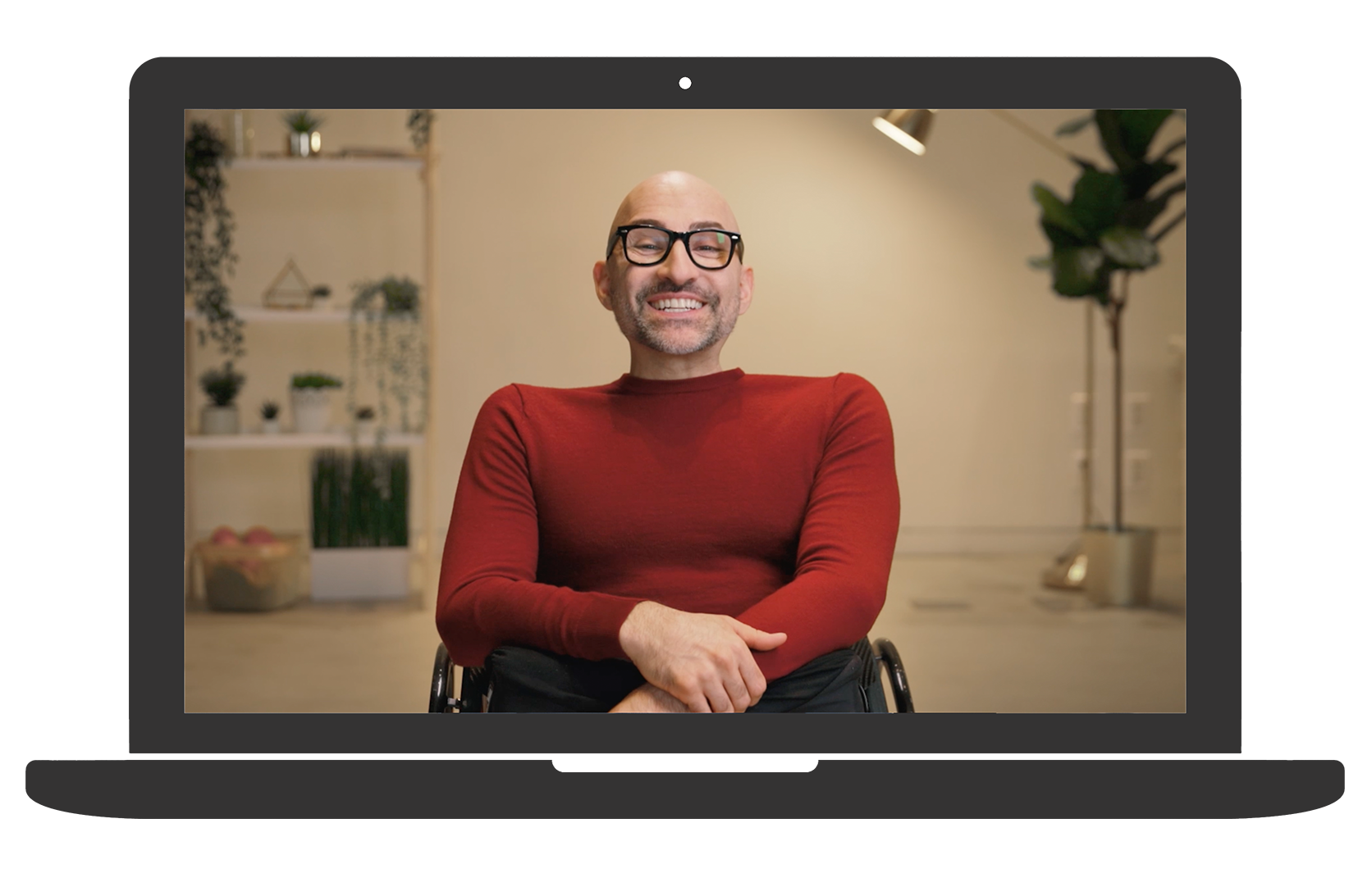 spencer west, a wheelchair user smiles as he appears on a laptop screen